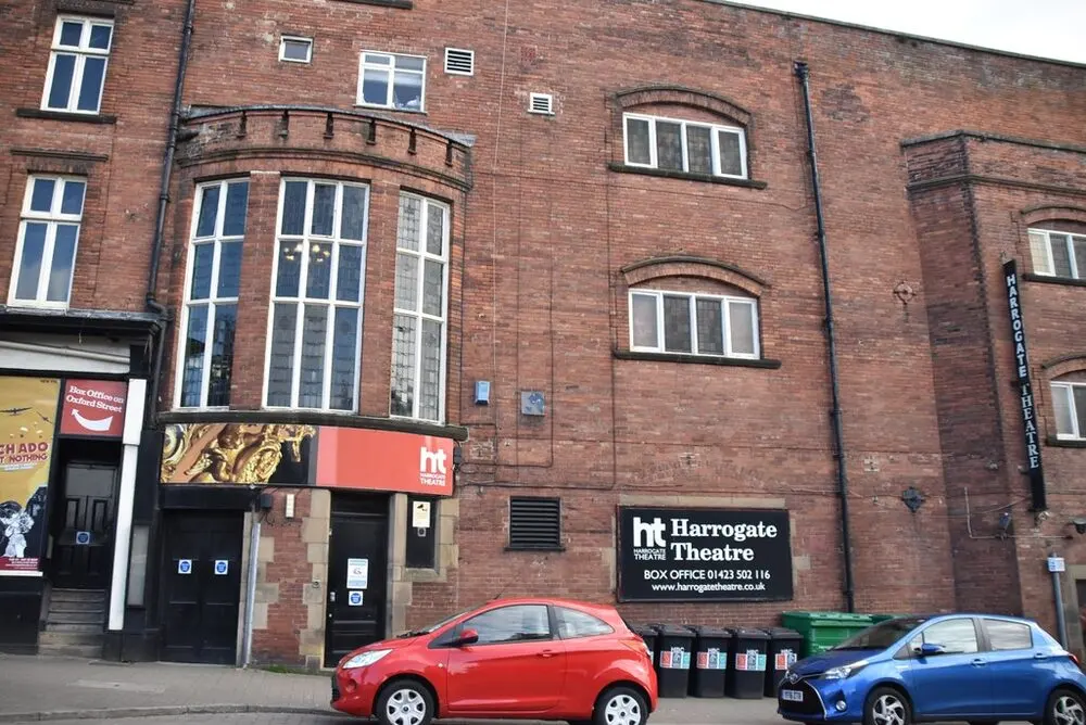 The brick front of Harrogate Theatre on Oxford Street with its box office sign
